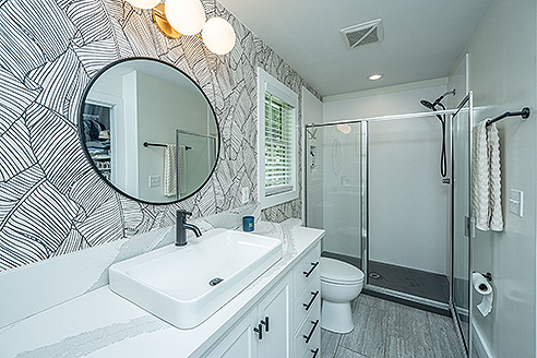 Glass shower enclosure with Corian shower pan